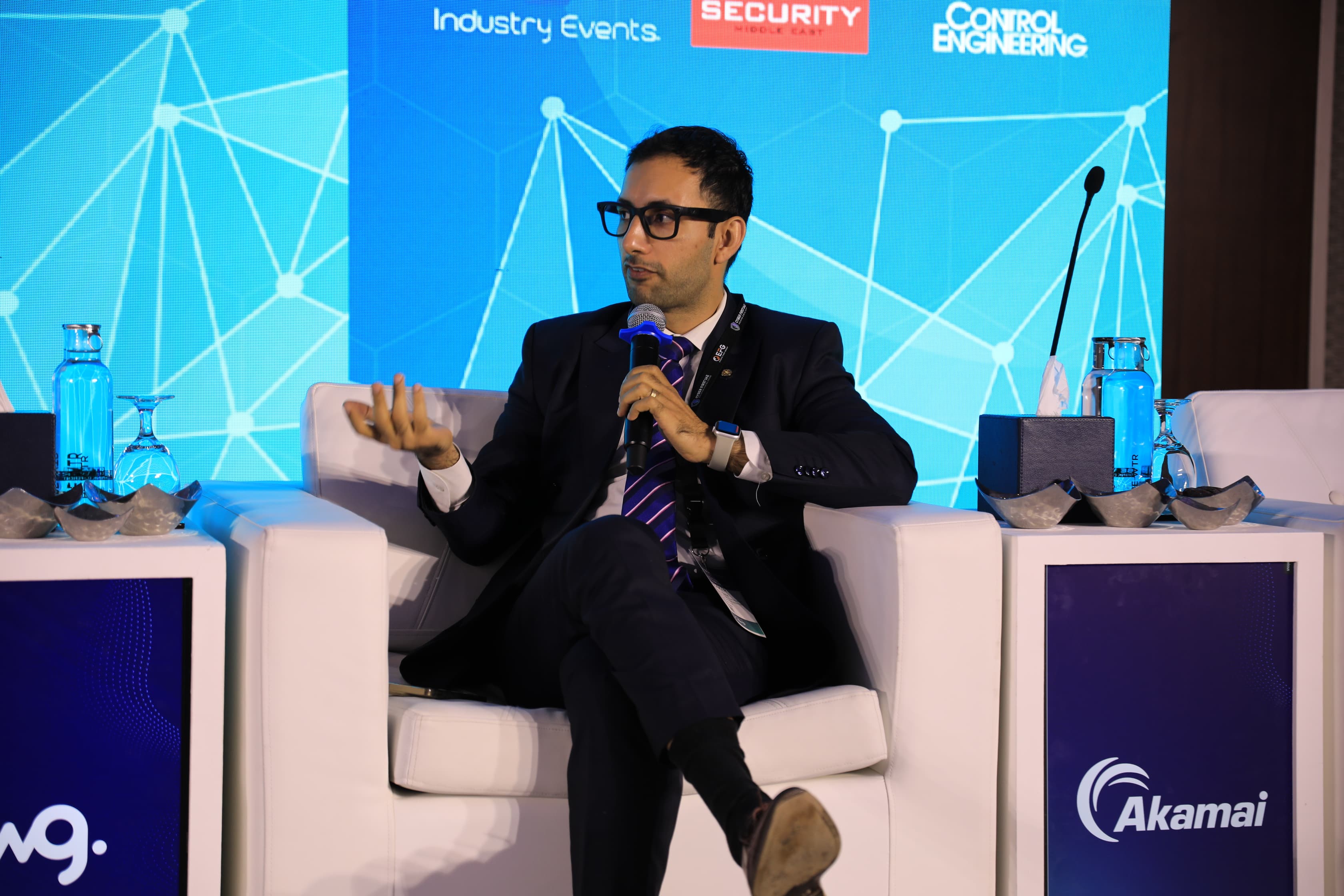A speaker on stage at Cyber First UAE