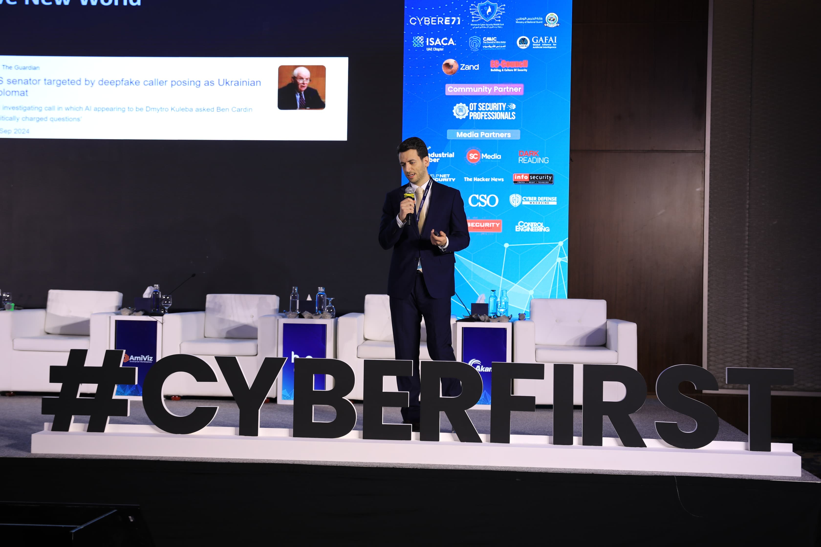 A speaker on stage at Cyber First UAE