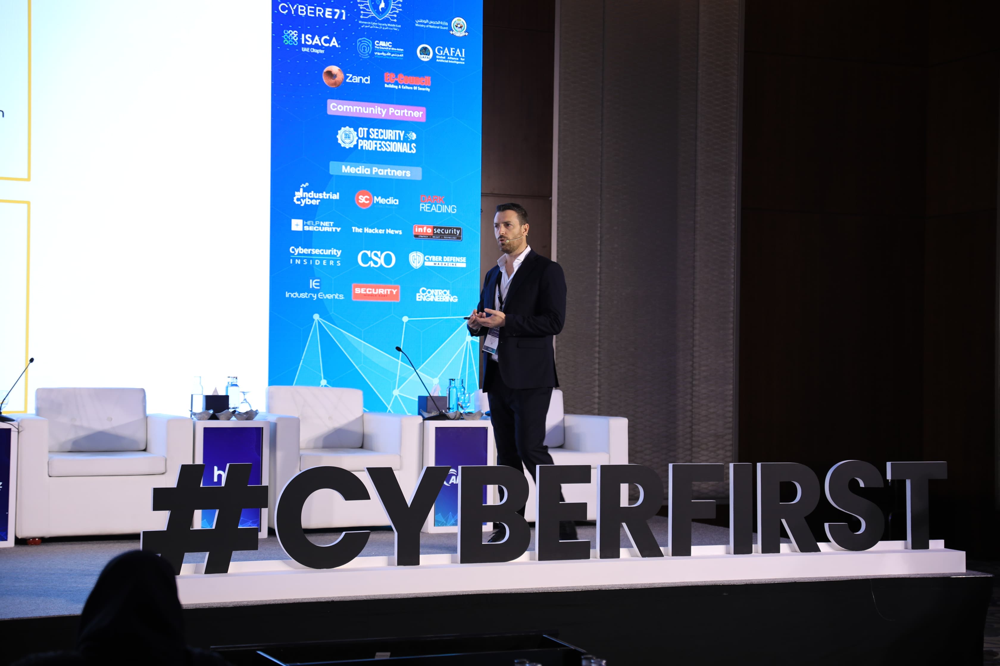 A speaker on stage at Cyber First UAE