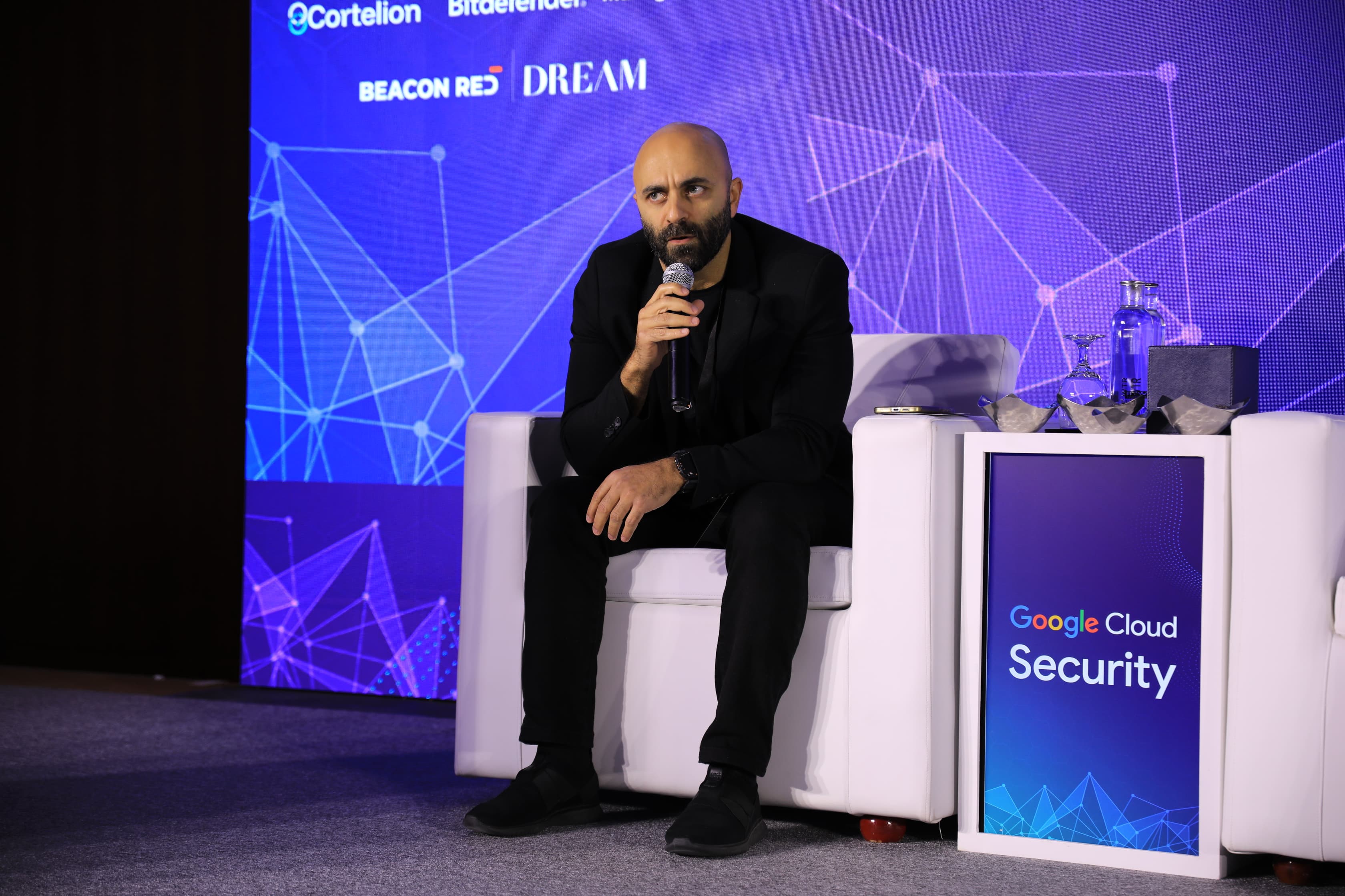A speaker on stage at Cyber First UAE