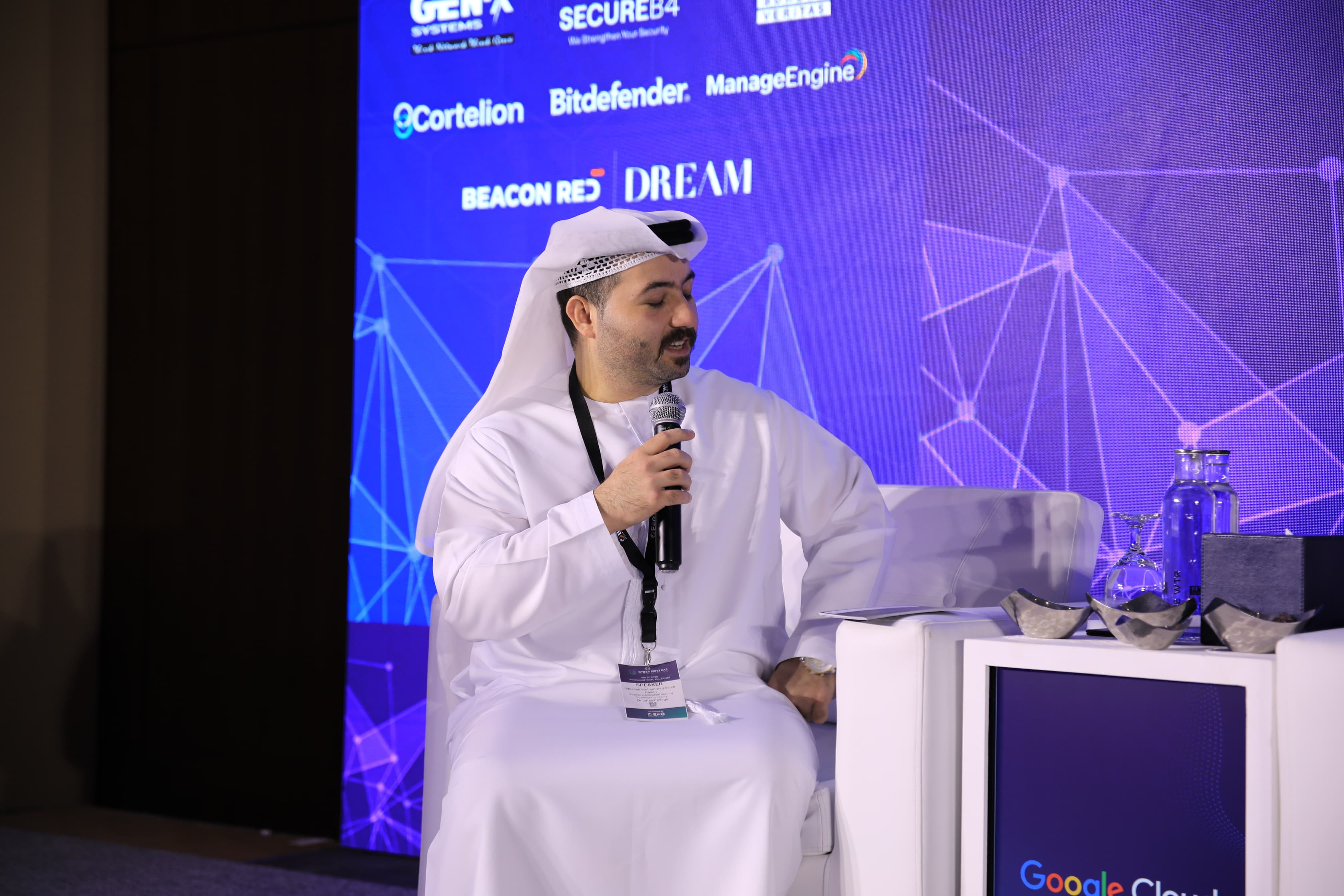 A speaker on stage at Cyber First UAE