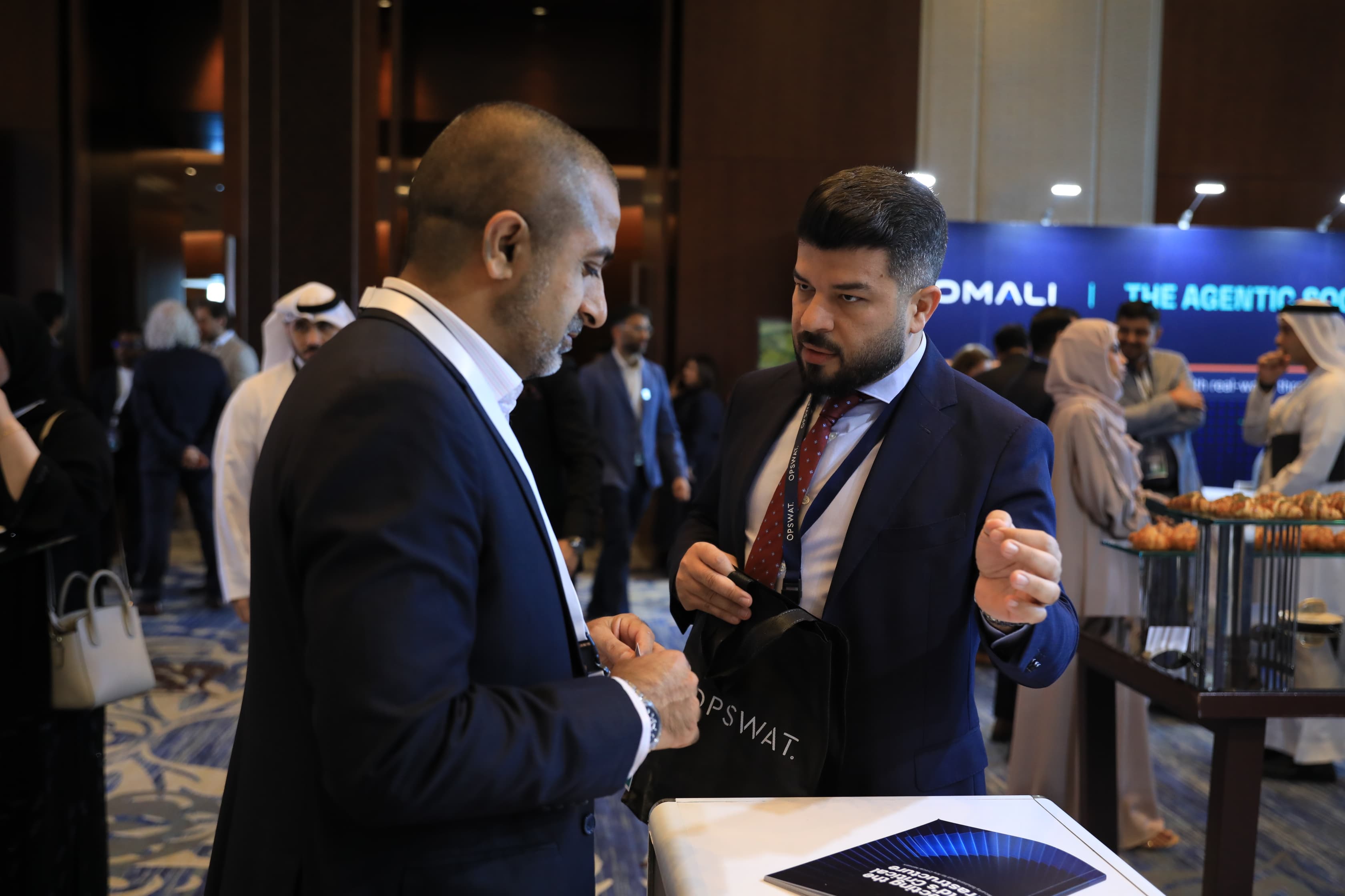 Delegates networking in the exhibition area at Cyber First UAE