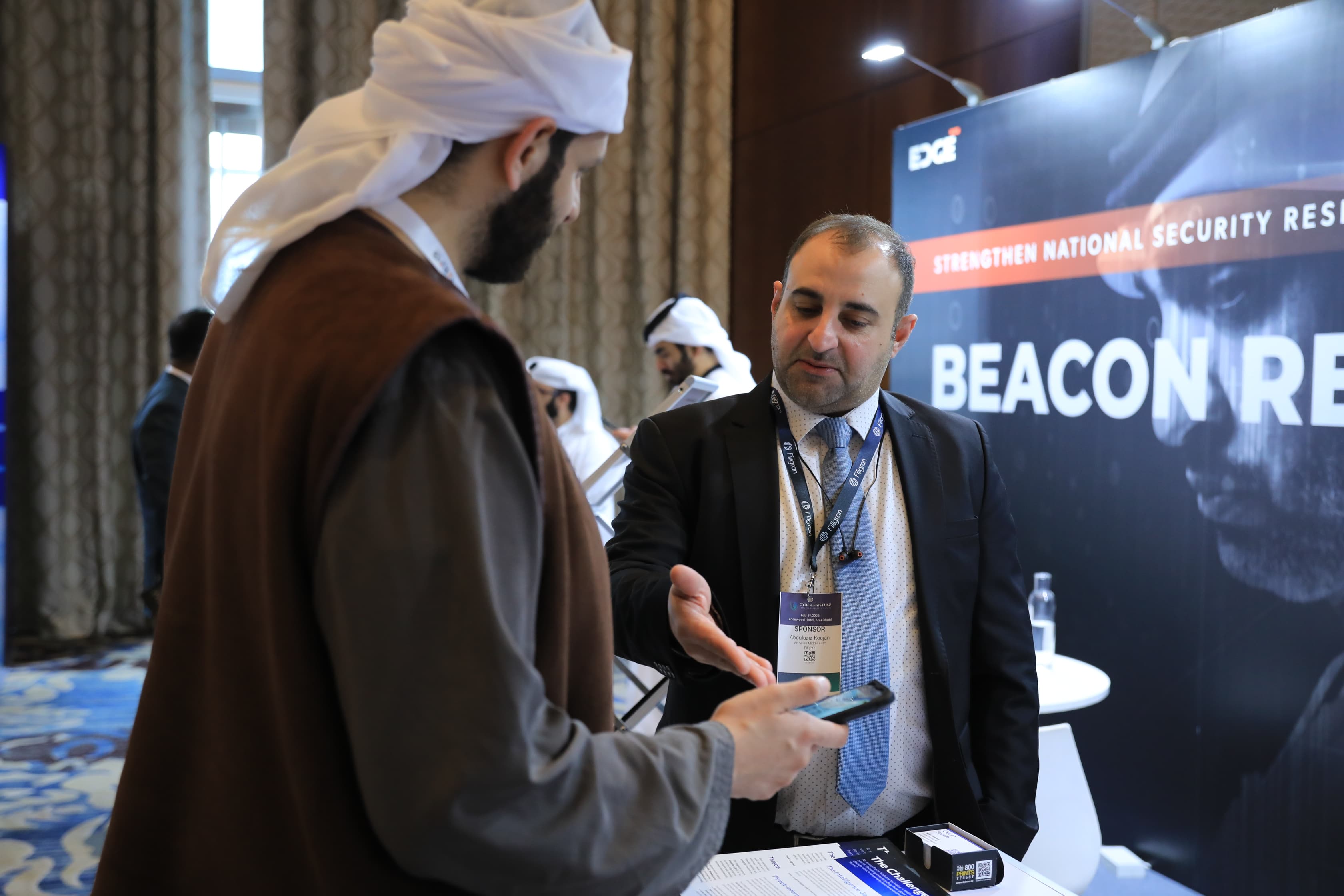 Delegates networking in the exhibition area at Cyber First UAE
