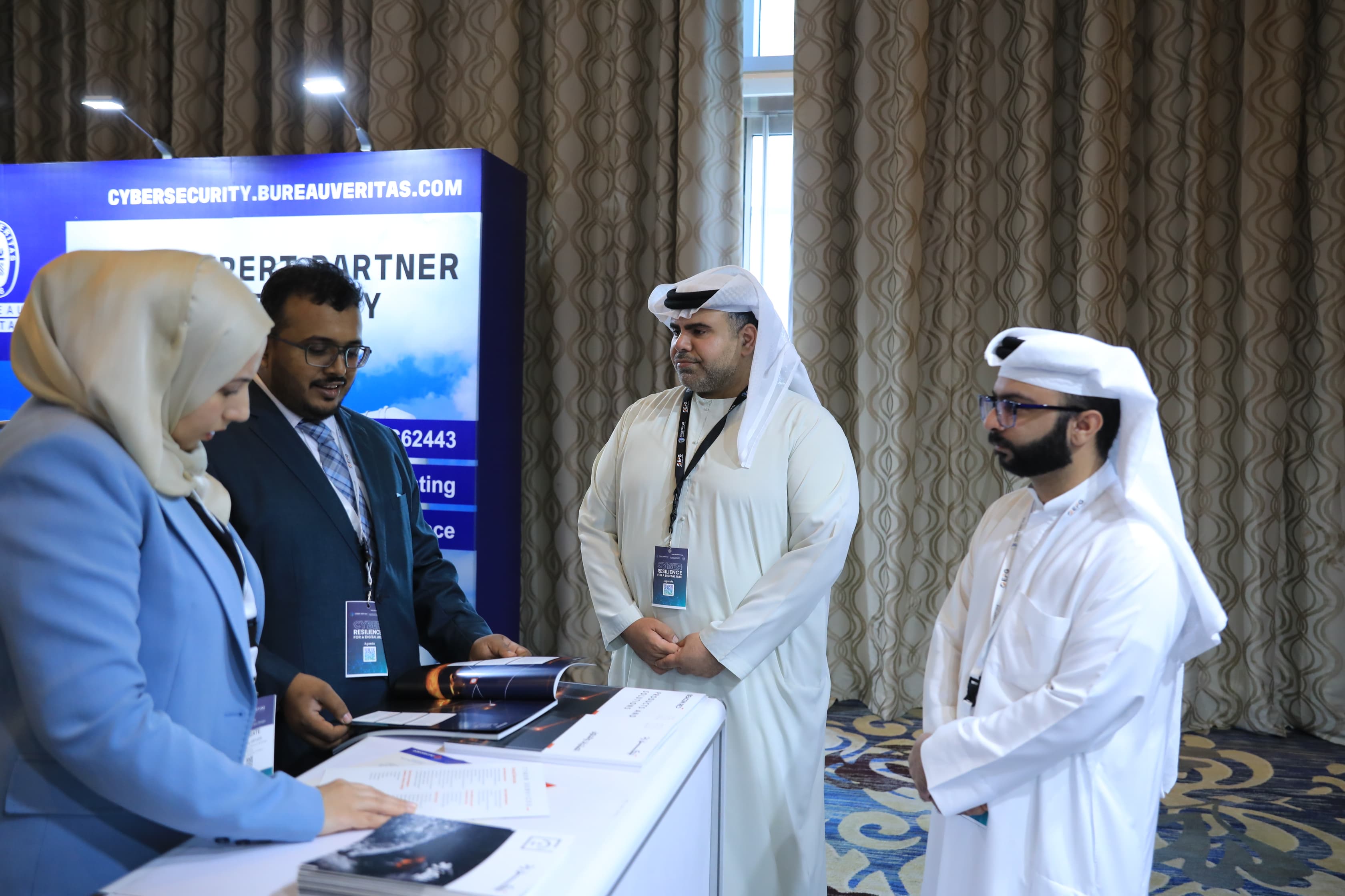 Delegates networking in the exhibition area at Cyber First UAE