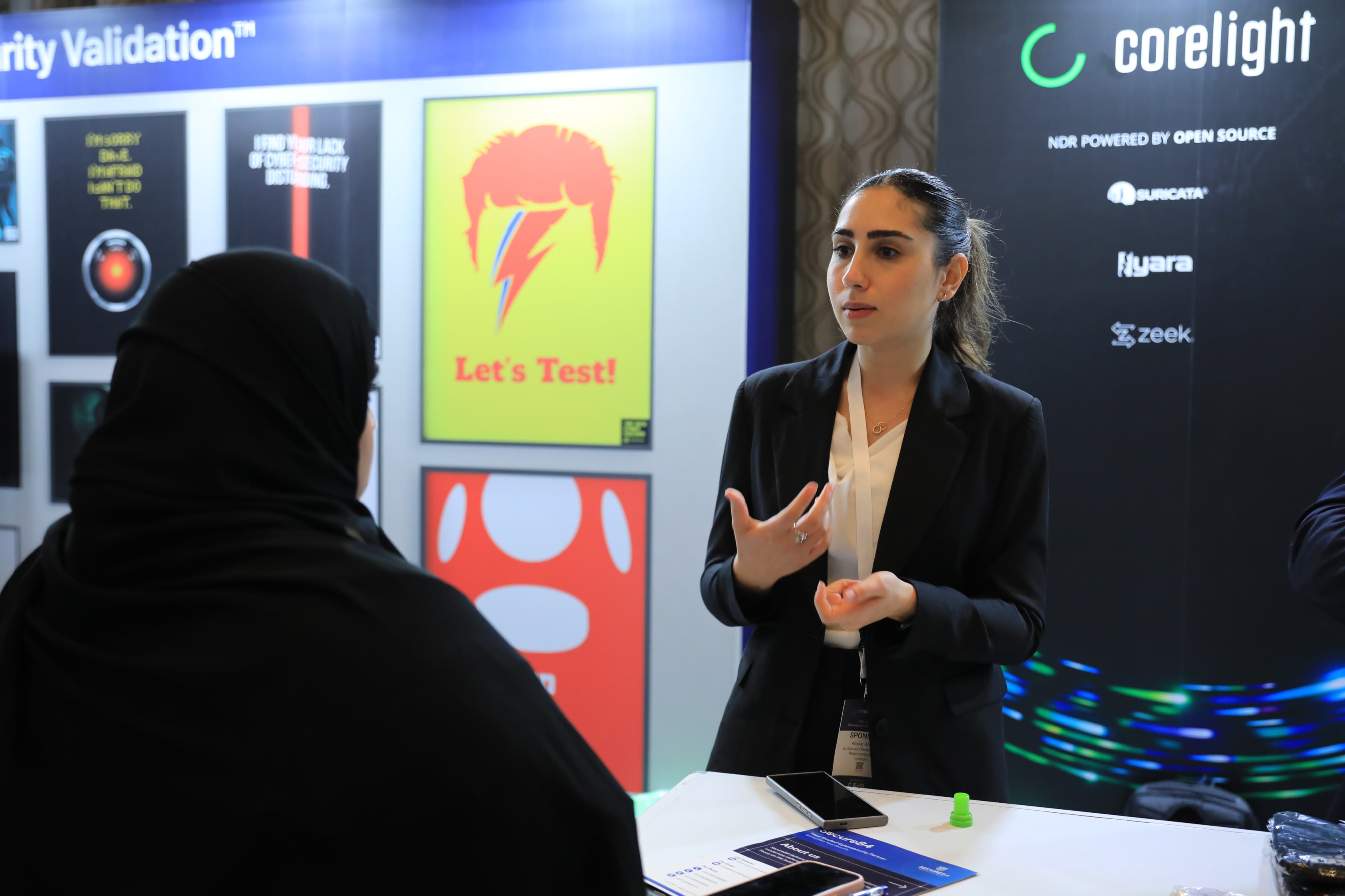 Delegates networking in the exhibition area at Cyber First UAE