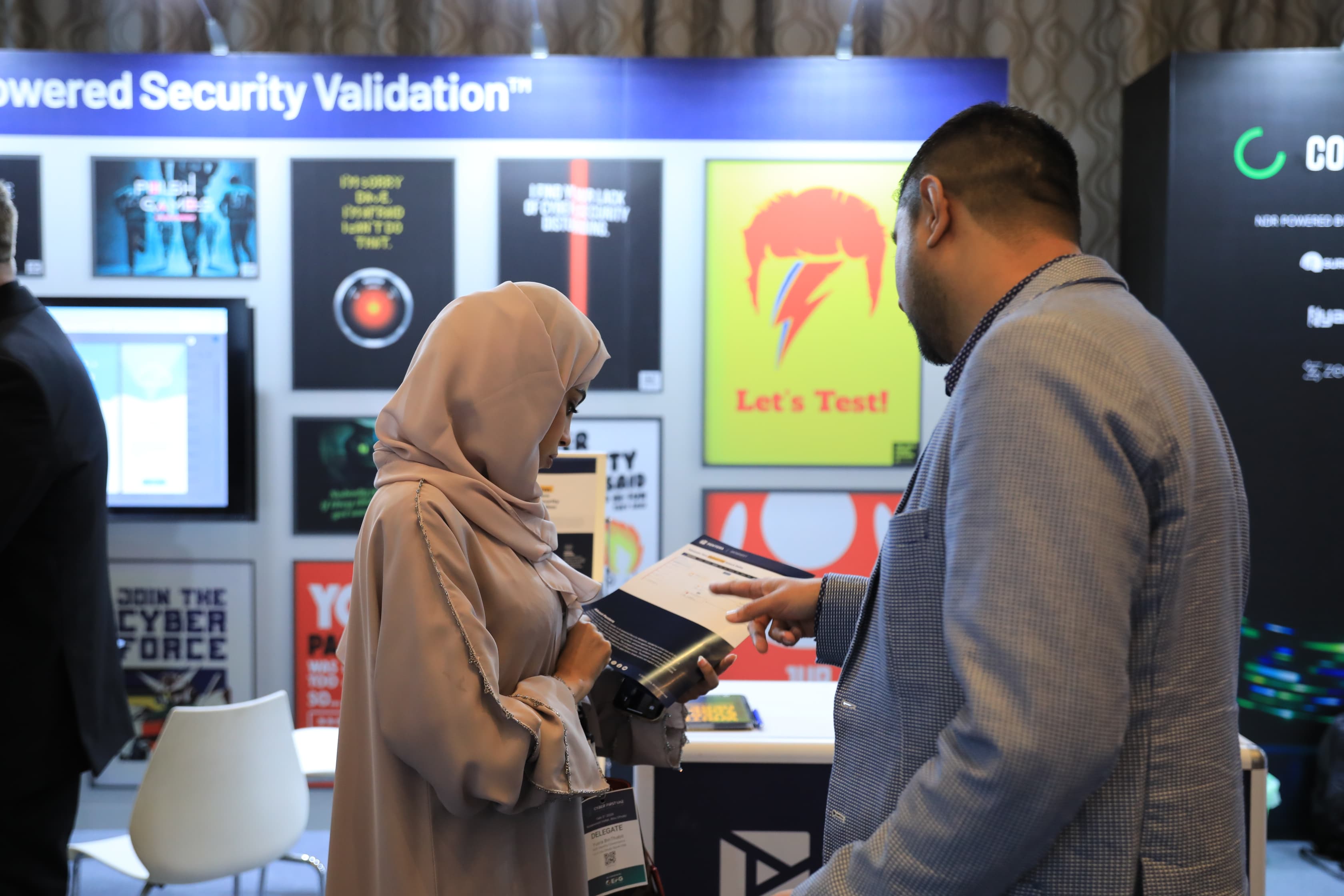 Delegates networking in the exhibition area at Cyber First UAE
